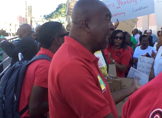 Former president of the SVG Teachers' Union, Oswald Robinson rally protesters in Kingstown on Tuesday. (iWN photo) 