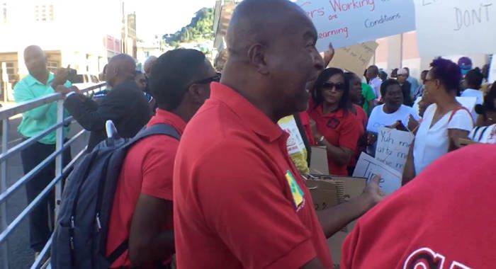 Former president of the SVG Teachers' Union, Oswald Robinson rally protesters in Kingstown on Tuesday. (iWN photo) 