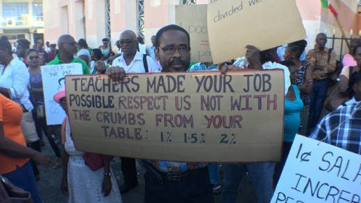 Educator and social commentator Philbert “P John” John pm the picket line on Tuesday. (iWN photo)