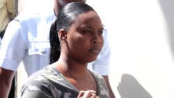 The accused, Suranie Graham leaves the Serious Offences Court after her arraignment on Monday. (iWN photo)