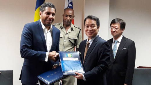 Taiwan ambassador to SVG, Calvin Ho, right, and SVG’s Minister of Finance, Economic Planning, Sustainable Development and Information Technology, Camillo Gonsalves at the signing ceremony at Friday. 