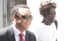 Andy “Blacka” Bennett, right, leaves the court in the company of his lawyer, Grant Connell. (iWN photo)