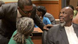 Central Leeward petitioner Benjamin "Ben" Exeter, centre, chats with former Leader of the Opposition, Arnhim Eustace, right, under whose leadership the NDP filed the petitions, chats with and Mrs. Jennifer Eustace. during the hearing. (iWN photo)