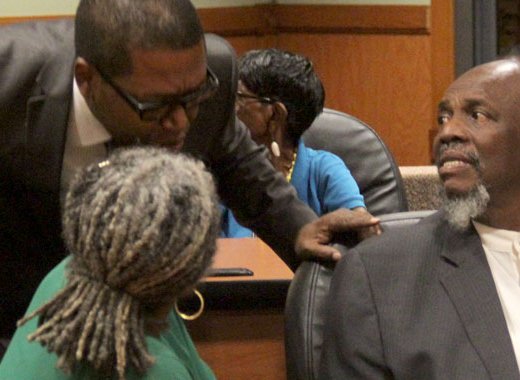 Central Leeward petitioner Benjamin "Ben" Exeter, centre, chats with former Leader of the Opposition, Arnhim Eustace, right, under whose leadership the NDP filed the petitions, chats with and Mrs. Jennifer Eustace. during the hearing. (iWN photo)