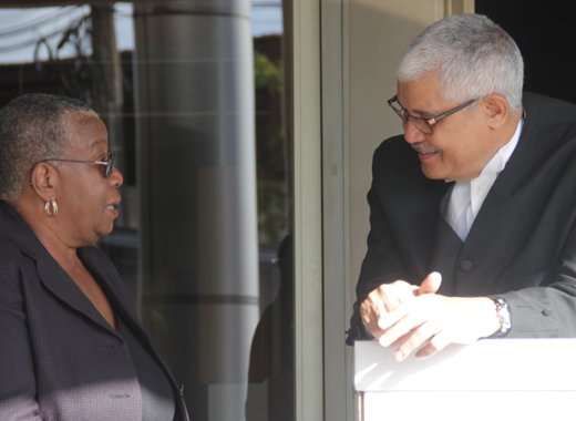Lead counsel in the Central Leeward petition, Douglas Mendes, right, chat with former supervisor of elections, Sylvia Findlay-Scrubb on Feb. 11, 2018, the first day of the trial. (iWN photo)