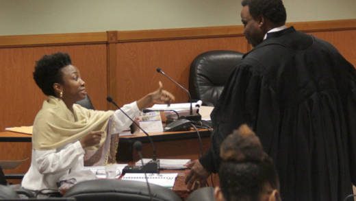 Lawyer Maia Eustace, a witness and lawyer in the NDP's election petition case, speaks with counsel Keith Scotland,of Trinidad, a member of the NDP's legal team during a break in Monday's trial in Kingstown. (iWN photo)