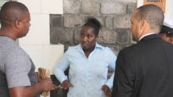 The accused woman, Eunice Dower, centre, outside the High Court with Detective James left, and her lawyer, Grant Connell, on Friday. (iWN photo)
