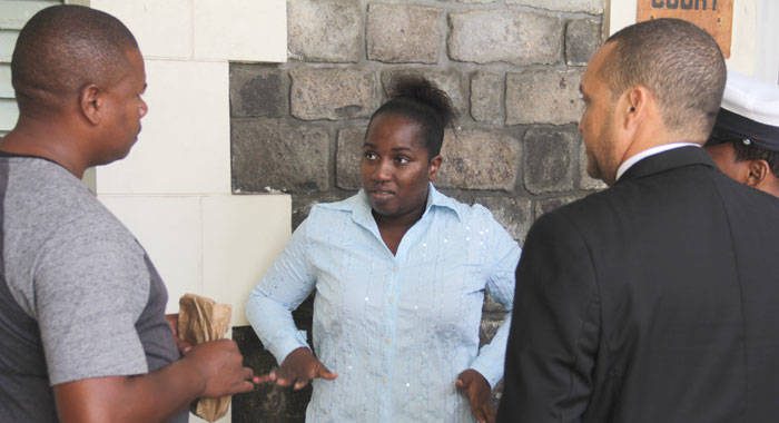 The accused woman, Eunice Dower, centre, outside the High Court with Detective James left, and her lawyer, Grant Connell, on Friday. (iWN photo)
