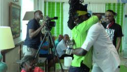 Vincentian soca artiste, Skinny Fabulous hugs his mother at Argyle International Airport on Wednesday, after returning home from Trinidad, where he won the Road March title alongside two artistes from that country. (iWN photo)