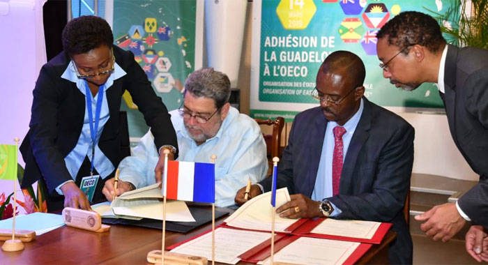 OECS Chairman, Prime Minister Ralph Gonsalves (left) signing agreement with the President of the Regional Council of Guadeloupe, Ary Chalus. 