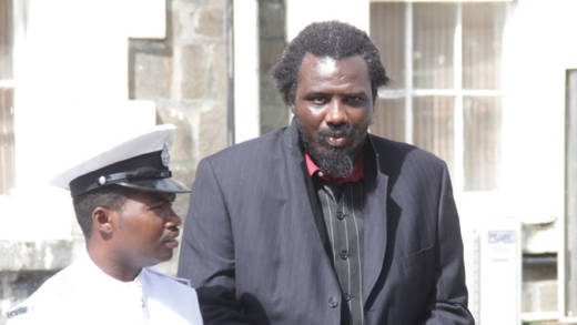 Junior Quashie is escorted back to prison after his sentencing on Friday. (iWN photo)