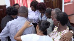 Some of the respondents in the case, including former Supervisor of Election, Sylvia Findlay-Scrubb huddle inside the courtroom after the judgement on Thursday. (iWN photo)