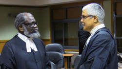 Queen's Counsel, Stanley "Stalky" John, left and Senior Counsel Douglas Mendes chat the end of the hearing last Thursday, during which the legal arguments got intense. (iWN photo)