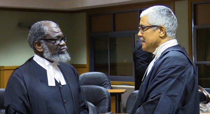 Queen's Counsel, Stanley "Stalky" John, left and Senior Counsel Douglas Mendes chat the end of the hearing last Thursday, during which the legal arguments got intense. (iWN photo)