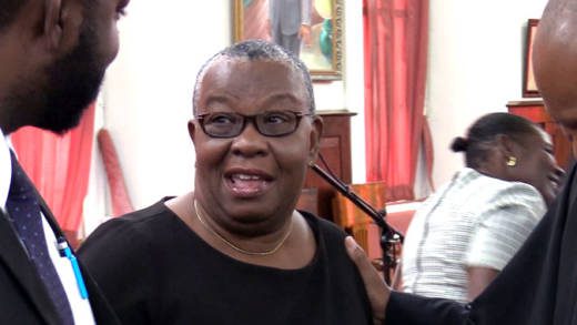 Former Supervisor of Elections, Sylvia Findlay-Scrubb chats with members of her legal team after the March 21 court ruling. (iWN photo)
