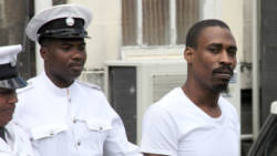 Andy Quashie is escorted back to prison after being sentenced for murder last Friday. (iWN photo) 