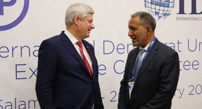 NDP president, Godwin Friday, right, speaks with Stephen Harper, former Prime Minister of Canada and Chairman of the IDU. 
