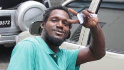 Coin thief GIlbert Spence poses after his court appearance on Monday. (iWN photo)