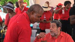 Prime Minister Ralph Gonsalves, right, chats with Minister of Housing, Montgomery Daniel at Thursday's rally in Kingstown. (iWN photo)