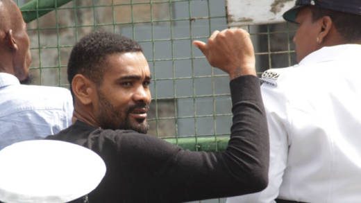 Terrance “Yellow” Smith gestures as he is escorted back to prison last Friday. (iWN photo)