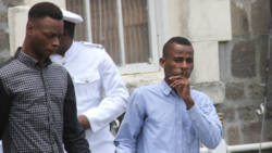 Tyson John, left and Kimani Joe are escorted to prison after their sentencing on Wednesday. (iWN photo) 