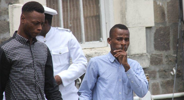 Tyson John, left and Kimani Joe are escorted to prison after their sentencing on Wednesday. (iWN photo) 