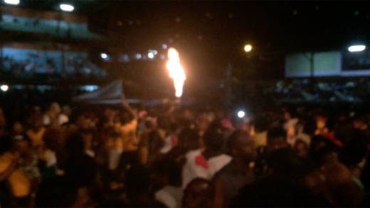 A reveller uses an aerosol to throw flames during SVG Soca Monarch finals. (iWN file photo)  