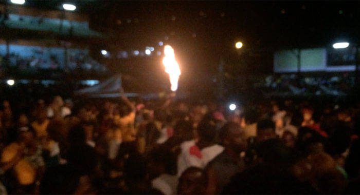 A reveller uses an aerosol to throw flames during SVG Soca Monarch finals. (iWN file photo)  