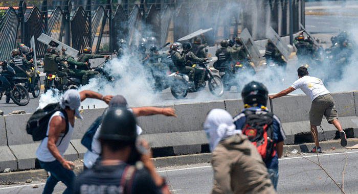 Thousands of Venezuelans took to the streets in Caracas heeding opposition Juan Guaidó’s call on Wednesday. (Photo: Matias Delacroix/Agence France-Presse — Getty Images)