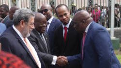 Prime Minister Ralph Gonsalves, left, introduces President of Ghana, Nana Addo Dankwa Akufo-Addo, centre to Member of Parliament in Kingstown on Wednesday. (iWN photo) 