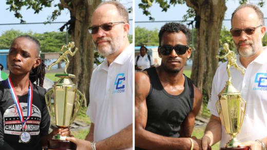 Vincentian athletes Linda Mc Dowald and Junior Ashton receive their trophies from CARICOM CARICOM Secretary-General Irwin LaRocque.