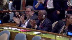 Prime Minister Ralph Gonsalves, left, and Deputy Prime Minister Sir Louis Straker applaud after the announcement of the results at the United Nations on Friday. Kingstown’s permanent representative to the UN, I. Rhonda King is at right.