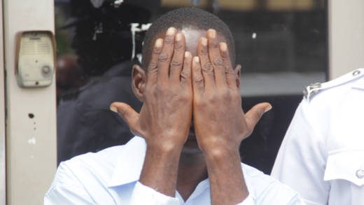 Security guard Lincoln Small exits the Kingstown Magistrate's Court after the proceedings on Monday. (iWN photo)