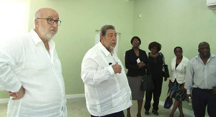 PM GOnsalves with education officials and Achille Pastor Ris representing developer