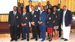 The police officers pose with Commissioner of Police Colin John. 