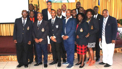 The police officers pose with Commissioner of Police Colin John. 