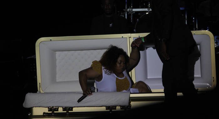 Shaunelle McKenzie is assisted out of the casket at Dimanche Gras at Victoria Park. She went on to capture the calypso crown. (iWN Photo)