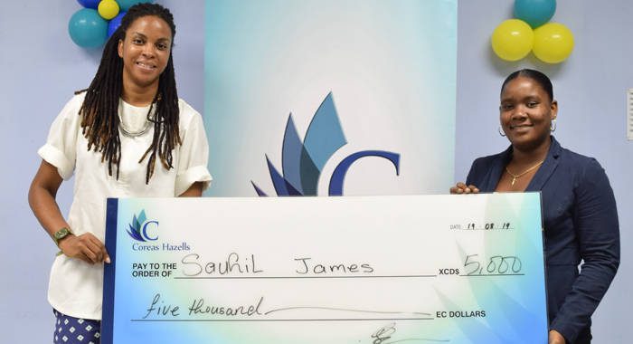 Soneek James, right, sister of Sauhil "Freddy" James, collects first prize cheque from Odini Sutherland, Coreas Hazells Marketing Manager.