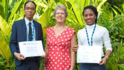 British High Commissioner Janet Douglas, centre, with Vincentian scholarship recepients, Jeshua Bardoo, left, and Jenell Gibson.