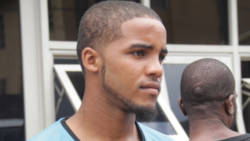 Enrique Gregg is escorted to prison on Monday. (iWN photo)