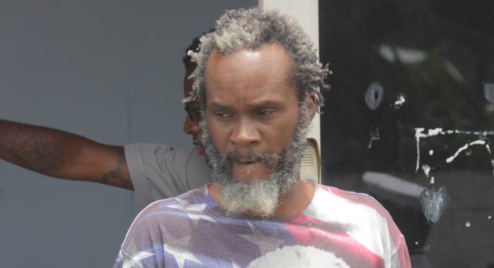 The report concerns Franklin Davis, who was charged with wounding in  2016. He is seen here leaving the Kingstown Magistrate's Court on Tuesday. (iWN photo)