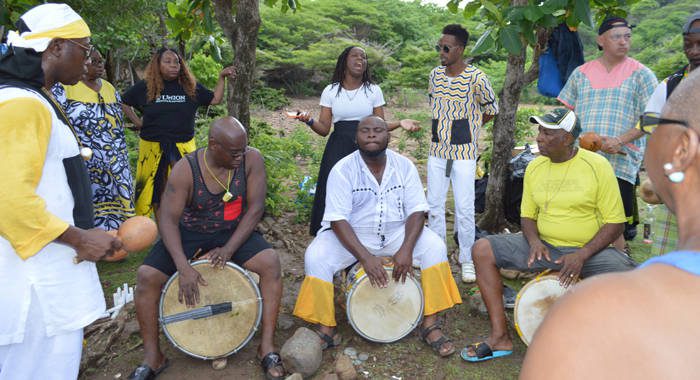 Garifuna sing and drum in August 2019 during a visit to Balliceaux, the Grenadine Island to which their forebears were taken before their exile to Central America in the late 18th century. 