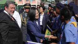 Taiwan President Tsai Ing-wen greets students in Kingstown during her official visit on July 16, 2019 as Prime Minister of SVG, Ralph Gonsalves, looks on. (iWN photo)