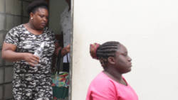 The women, Bernadette Myall, left, and Tannisha Jennings, leave the Serious Offenses Court for the Central Police Station on Monday. (iWN photo)