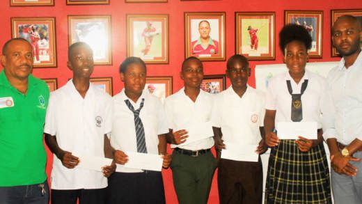 The scholarship recipients pose with SVGCA officials.