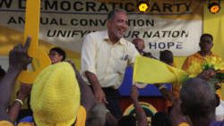 NDP President and Opposition Leader Godwin Friday interact with party supporters before making his speech at the NDP's convention rally in Arnos Vale on Sunday. (iWN photo)