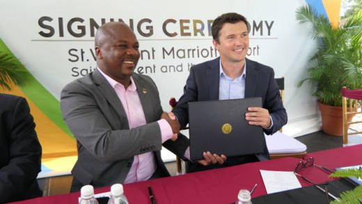 Manager of National Properties Ltd., Hans King, left, shakes hands with Bojan Kumer, Marriott International’s vice president for hotel development -- Caribbean and Latin America, after signing the management contract. (Photo: Discover SVG/Facebook) 