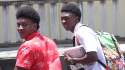Robbery accused, Ozem Oliver, right, and Andreas Bruce leave the Serious Offenses Court after being committed to stand trial on Friday. (iWN photo)