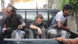 From left: Drug accused Glenlyn Lee, Lonnie Raymond James Wilson, and Jomodean Alexander arrived at the Serious Offences Court, on Thursday, aboard a police pickup. (iWN photo)  
