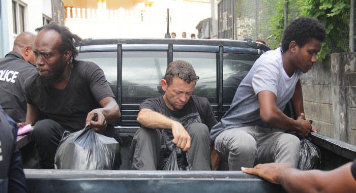 From left: Drug accused Glenlyn Lee, Lonnie Raymond James Wilson, and Jomodean Alexander arrived at the Serious Offences Court, on Thursday, aboard a police pickup. (iWN photo)  